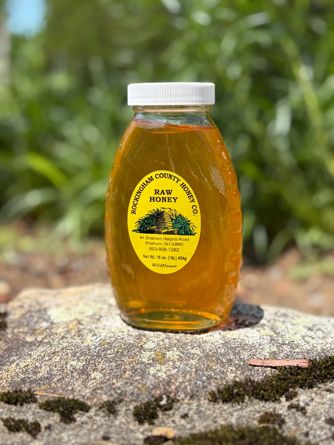 Jar of our raw Wildflower honey, freshly poured